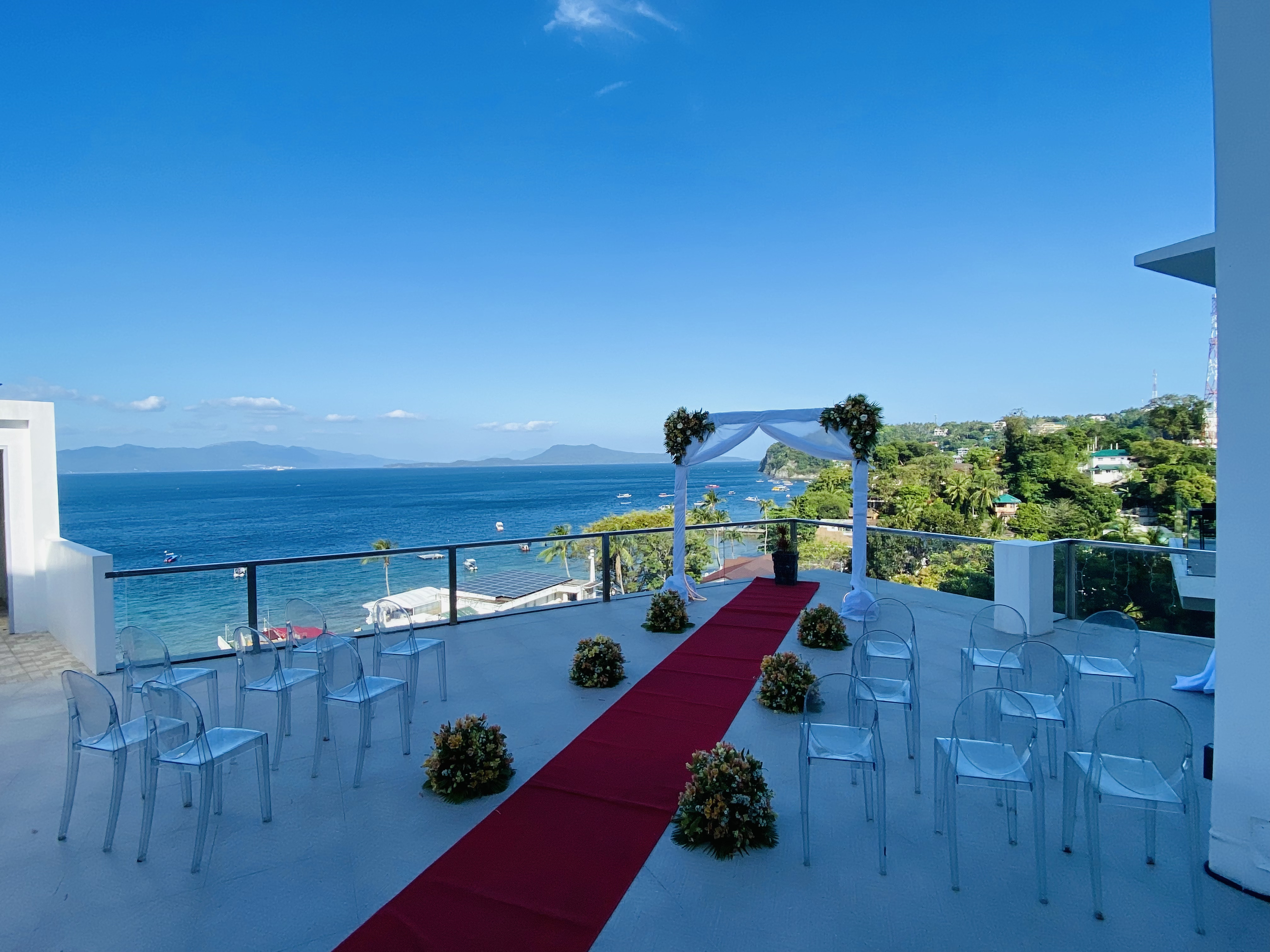 Wedding or group dinner setup around the pool area